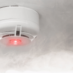 why is my smoke alarm flashing red